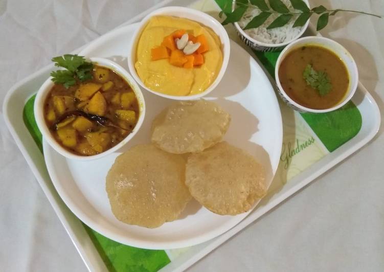 Recipe of Ultimate Gujarati lunch (rasadar aloo sabji, amrakhand, puri, dal, rice)