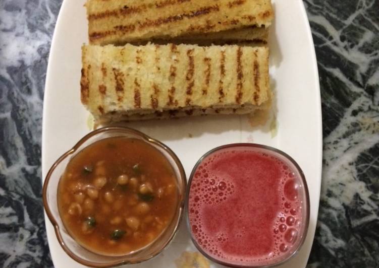 Baked beans with homemade garlic bread and fresh watermelon juice