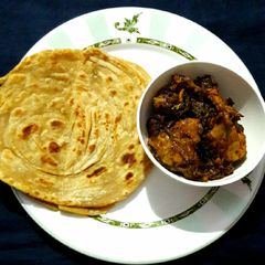A picture of Bhuna Chicken with Lachha Paratha.