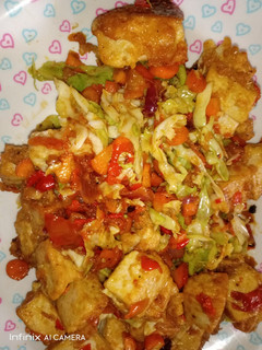 A picture of Awara/tofu with vegetable sauce.