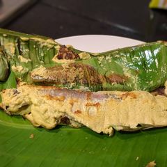 Pabda Paturi (Pabda fish cooked in banana leaf) A picture of Pabda Paturi (Pabda fish cooked in banana leaf).