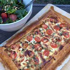 A picture of Onion, cheese and tomato tart.