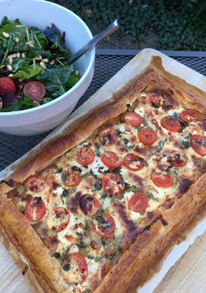 A picture of Onion, cheese and tomato tart.