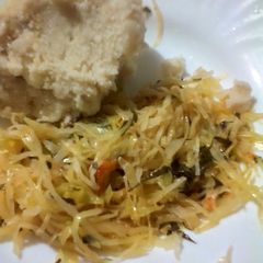 A picture of Ugali with fried cabbages.