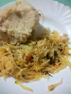 A picture of Ugali with fried cabbages.