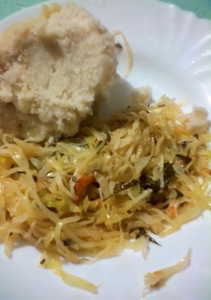 A picture of Ugali with fried cabbages.