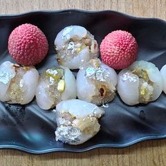 A picture of Stuffed litchi with petha and dry fruits.