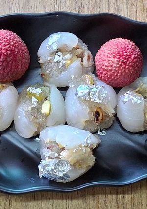 A picture of Stuffed litchi with petha and dry fruits.