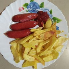 A picture of Smokies with fries.