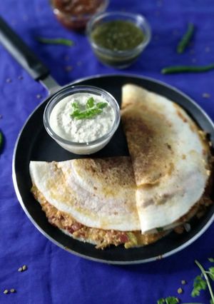 A picture of Schezwan paneer masala dosa.