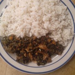 White rice garnish with vegetables sauce A picture of White rice garnish with vegetables sauce.