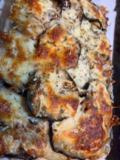 Una foto de Berenjenas a la parmiggiana con puré