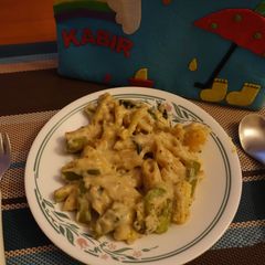 A picture of Whole wheat pasta with white sauce.