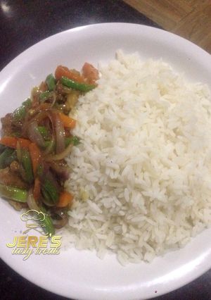 A picture of White rice with shredded beef.