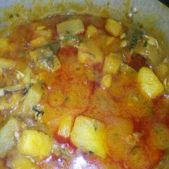 A picture of Beans yam porridge with veg leaf.