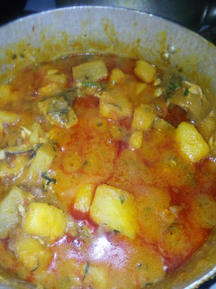 A picture of Beans yam porridge with veg leaf.