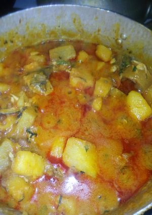 A picture of Beans yam porridge with veg leaf.