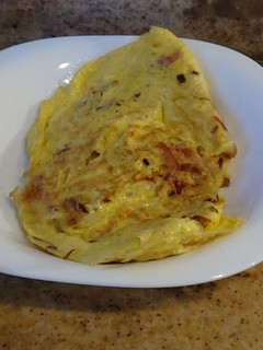Una foto de Tortilla de cebolla y bacon
