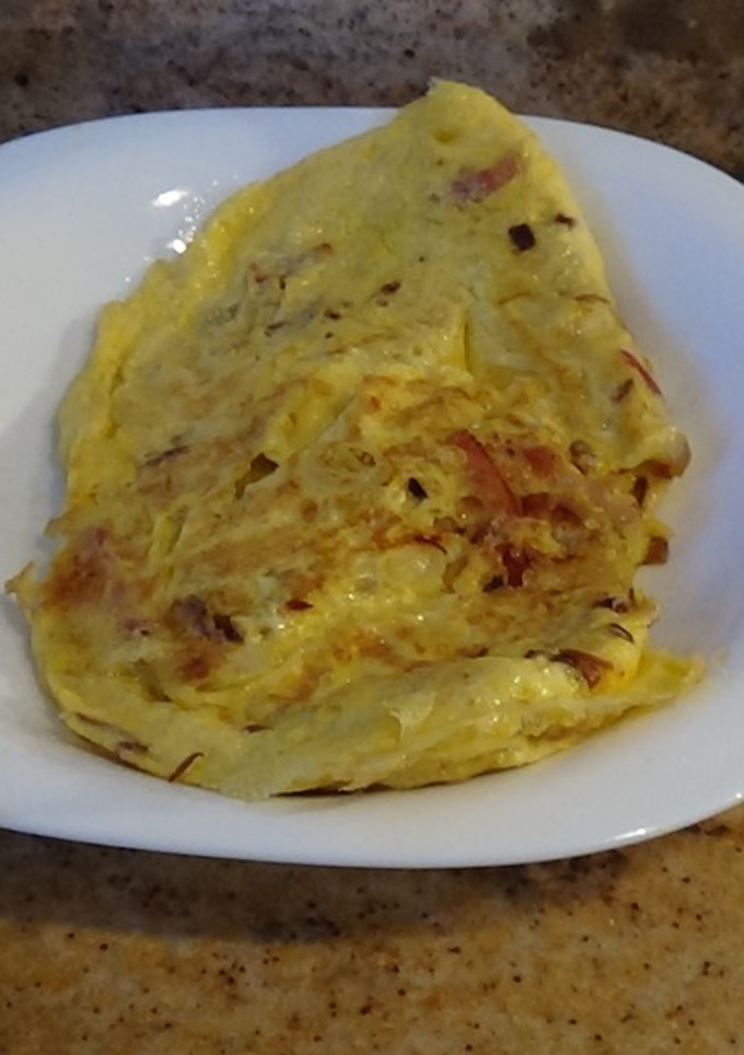 Una foto de Tortilla de cebolla y bacon