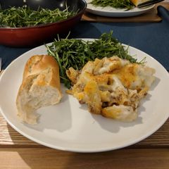 A picture of Greek lamb pastitsio bake with rocket salad.