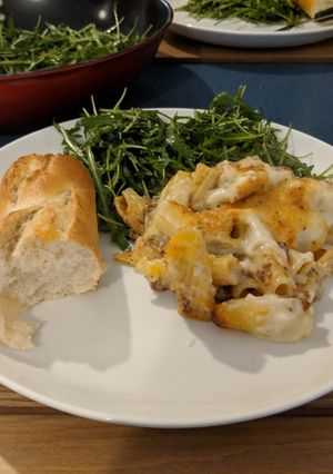A picture of Greek lamb pastitsio bake with rocket salad.