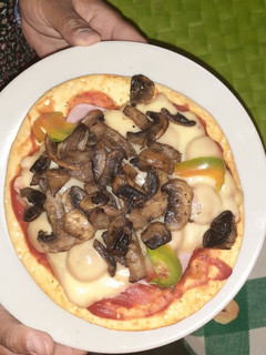 Una foto de Pizza con champiñones
