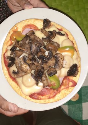 Una foto de Pizza con champiñones
