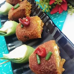 A picture of Moong Dal-Suji Roll with Paneer Stuffing.