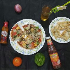 A picture of Peri Peri Paneer Pizza.