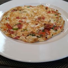 A picture of Tomato onion uttapam.