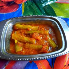 A picture of Drumstick in tomato curry.