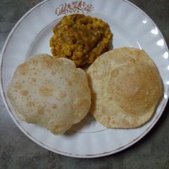 A picture of Luchi cholar daal(puri and chana daal).