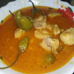 A picture of Chicken achar with chapati.