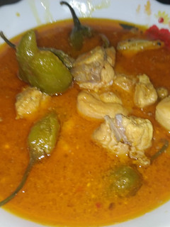 A picture of Chicken achar with chapati.