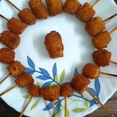 A picture of Crispy Baby Corn Sticks.