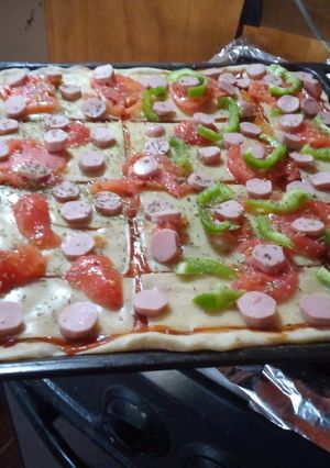 Una foto de Pizza con masa casera