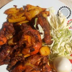 A picture of Grilled chicken with potatoes.