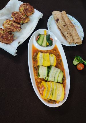 A picture of Pumpkin dal gravy Zucchini baked cheese tolls.