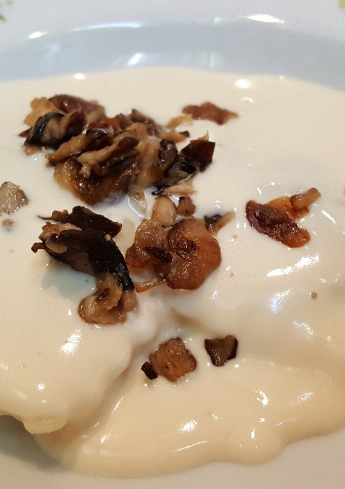 Una foto de Raviolis de boletus y salsa 4 quesos