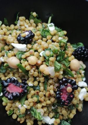 A picture of Giant cous cous, chickpeas, blackberry and feta salad.