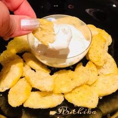 A picture of Dil leaves and cheese dip.