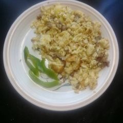 A picture of Scrambled eggs with burger.