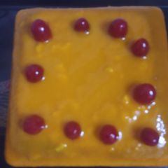 A picture of Mango cherry glaze cake.