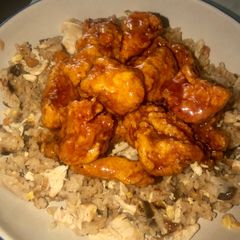 A picture of EASY orange chicken and fried rice.