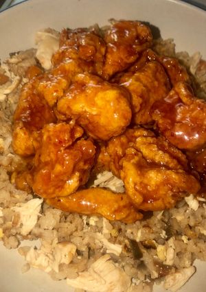 A picture of EASY orange chicken and fried rice.