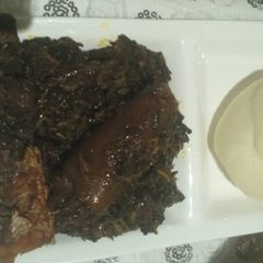 A picture of Afang soup with pounded yam.