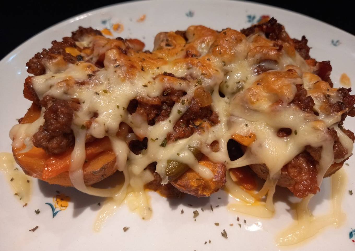 Cheesy bacon bolognese stuffed sweet potatoes
