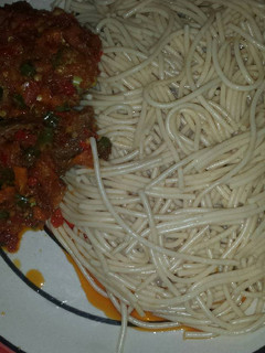 A picture of Spaghetti with tomatoes sauce.