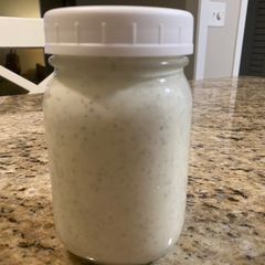 A picture of Ranch dressing and dipping sauce.