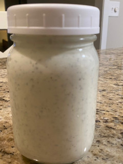 A picture of Ranch dressing and dipping sauce.